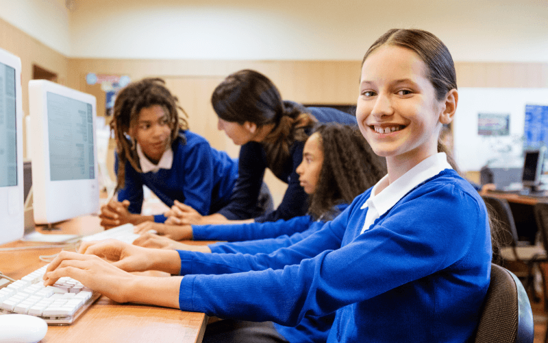 young person at school seated at computer